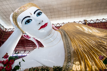 Beautiful Reclining Buddha Chauk htat gyi. Buddha Temple in Yangon, Myanmar,