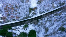 Following Car From Above, Amazing Aerial Drone Shot, Snowy Landscape Mountains