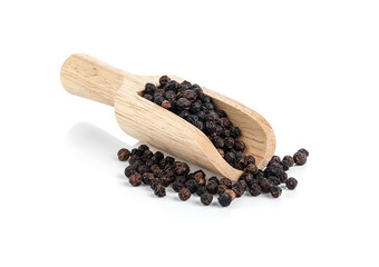 Black pepper with wooden scoop on white background