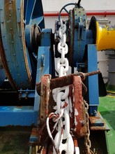 White Painted Anchor Windlass Chain On A Anchor Handling Tug Boat