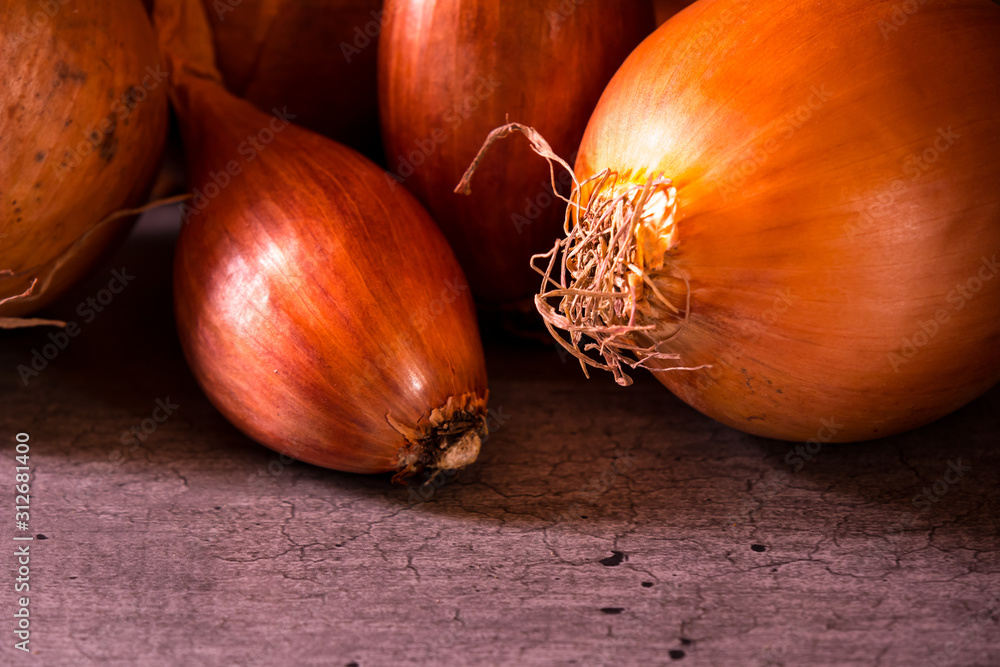 onions and shallots with a nice light for a kitchen decoration poster