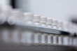 pill bottle in row on pharmaceutical manufacturing line