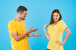 © SHOTPRIME STUDIO - young couple in t-shirts chatting