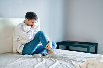 Wall Mural - man using laptop on bed