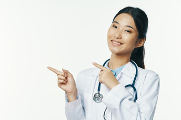 portrait of a female doctor with stethoscope isolated on white