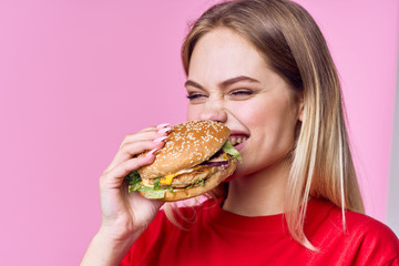 woman eating hamburger