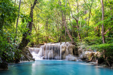 Waterfall and blue emerald water color in Erawan national park. Erawan Waterfall, Beautiful nature rock waterfall steps in tropical rainforest at Kanchanaburi province, Thailand