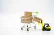 © zasabe - Online shopping with a shopping cart and shopping bags delivery service using as background shopping concept and delivery service concept with copy space  for your text or  design.