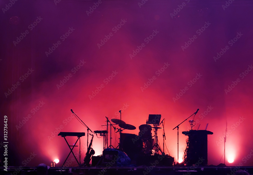 concert stage on rock festival, music instruments silhouettes, colorful background with copy space - obrazy, fototapety, plakaty 