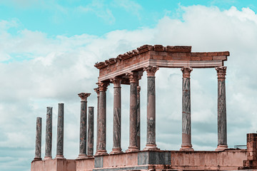 Scaenae frons in the Antique Roman Theatre in Merida. Panorama image. The Archaeological Ensemble of Merida is declared a UNESCO World Heritage Site Ref 664. Orange and teal style