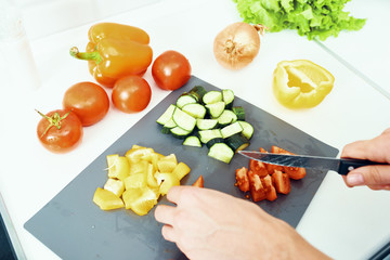 woman cutting vegetables in the kitchen