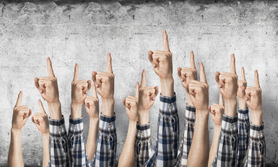 Wall Mural - Row of man hands showing finger pointing gesture