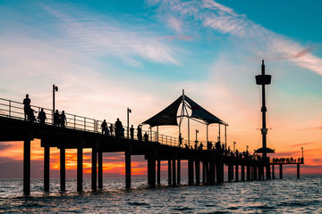 Wall Mural - Brighton Beach pier silhouette with people at dusk in summer, South Australia