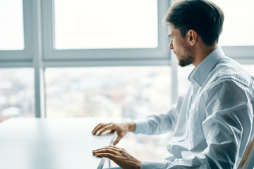 Wall Mural - businessman looking at digital tablet in office