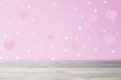 wooden table on pink background