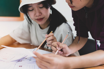 Wall Mural - asian startup designer creating user experience ux web on smartphone or mobile layout development. u