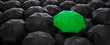 Leinwandbild Motiv Green umbrella stand out from the crowd of many black umbrellas - being different concept