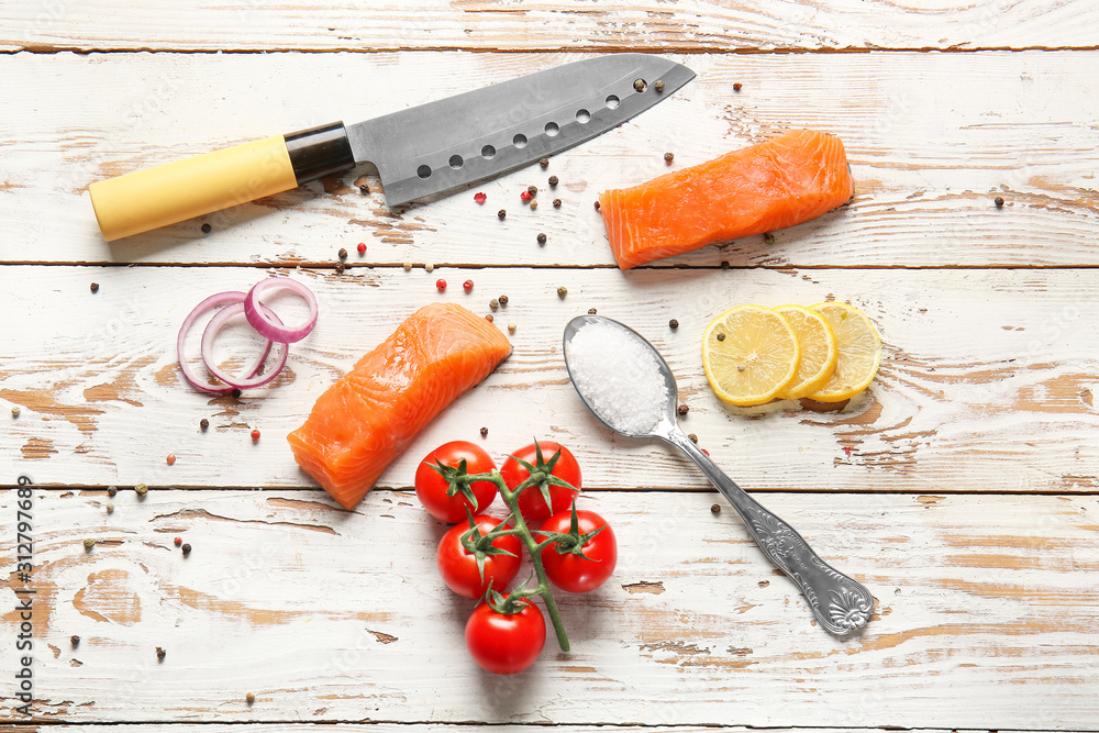 Composition with raw salmon on table