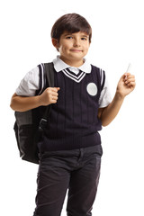 Wall Mural - Schoolboy in a uniform holding a chalk