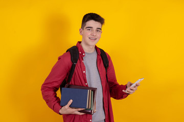 Wall Mural - young man or teenage student isolated on color background