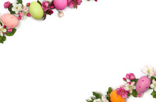 Easter Decoration. Easter Frame Of Pink Flowers Apple Tree And Colored Easter Eggs On White Background With Space For Text. Top View, Flat Lay