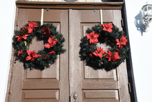 Christmas Wreaths On The Doors To An Old Church