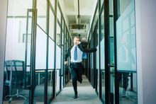 Businessman Rushing And Running On Office Hallway