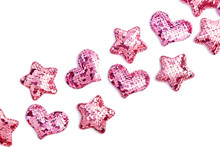 Valentine's Day Decorative Bakground. Pink Sequin Hearts And Stars On White