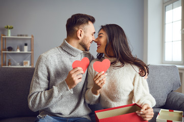 Wall Mural - Valentine's day. Couple gives heart to the Valentine's Day in the room.