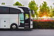 canvas print picture - travel company bus greets tourists at the airport to take to the hotel
