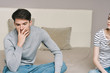 © SHOTPRIME STUDIO - young man sitting on sofa and looking at camera