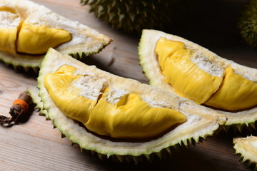 Wall Mural - Durian riped and fresh ,durian peel with yellow colour on wooden table.