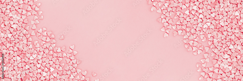 Trendy shining silver candy pink hearts background of cake sprinkles in flat lay with copy space, for feminine blogger or festive love and Valentine's Day concept. Long banner mockup - obrazy, fototapety, plakaty 
