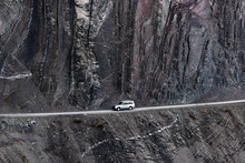 Car On Mountain Road Along Steep Cliffs
