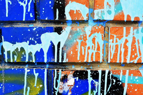 Brick wall painted with acrylic multicolored paint surface for background