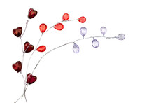 Silver Sprigs With Glass Burgundy Hearts, Red And Purple Droplets Isolated On White Background
