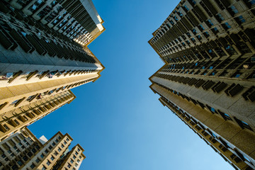 Poster - looking up on high rise apartment buildings - skyscraper and blue sky