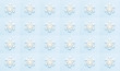 White wooden snowflakes on a gentle blue pale background. Geometric arnaments. Pattern. The background. Screensaver.