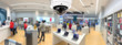 © jayzynism - CCTV security panorama with shop store blurry background.