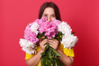 © sementsova321 - Image of charming adorable female having black hair, covering half of her face with bouquet of flowers, holding white and pink peonies, being positive, getting presents for saint valentines day.