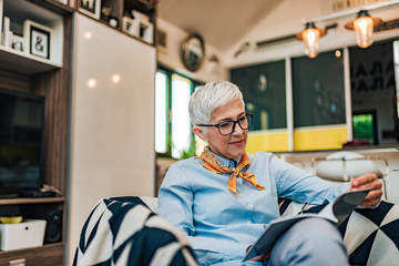 Poster - Beautiful mature woman enjoying at home, portrait.