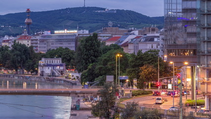 Wall Mural - Aerial view along the Danube Canal in Vienna night to day timelapse before sunrise