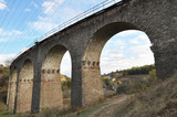 Fototapeta Na drzwi - Viaduct is a 9-arch railway bridge in the village of Plebanivka near Terebovlya, Ukraine