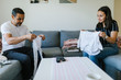 © Johnér - Father and teenage daughter folding clothes