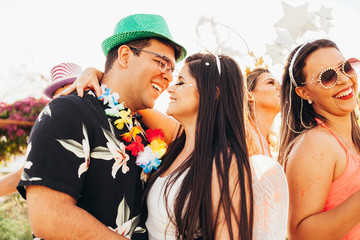 Wall Mural - Brazilian Carnival. Couple in costume enjoying the carnival party in the city