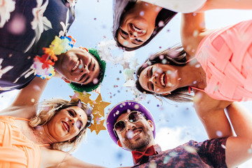 Wall Mural - Brazilian Carnival. Group of Brazilian people in costume celebrating the carnival party in the city