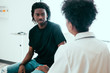 © Gerald Carter/Creative Flame - Male patient listening to doctor