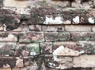 Grunge dirty old brick stone wall exterior on ancient temple architecture