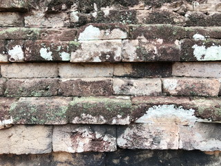 Grunge dirty old brick stone wall exterior on ancient temple architecture