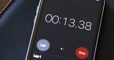 Numerical digital stopwatch with white number and black screen on cellphone